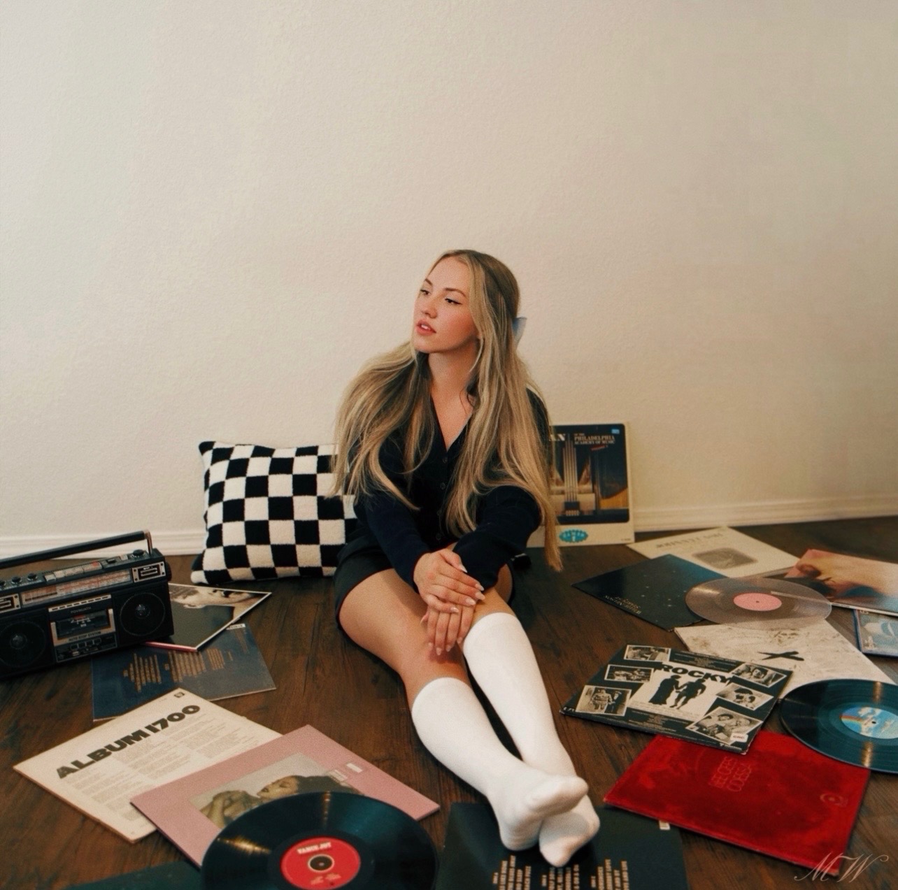 Madelynne West with records and a vintage boombox